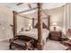 Spacious Primary bedroom with a large four-poster bed and ensuite bathroom at 3314 E Azalea Dr, Gilbert, AZ 85298