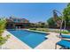 Inviting pool area with lounge chairs and an umbrella at 3314 E Azalea Dr, Gilbert, AZ 85298