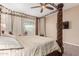 Bright Primary bedroom with a large four poster bed and plenty of natural light at 3314 E Azalea Dr, Gilbert, AZ 85298