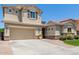 Two-story home with a large garage and attractive landscaping at 3314 E Azalea Dr, Gilbert, AZ 85298