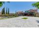 Large backyard with paved patio, grass, and pool at 3314 E Azalea Dr, Gilbert, AZ 85298