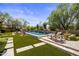 Stunning pool and spa area with stone accents and lush landscaping at 18826 N 101St Pl # 10, Scottsdale, AZ 85255