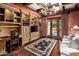Home office with built-in bookcases and hardwood floors at 18826 N 101St Pl # 10, Scottsdale, AZ 85255