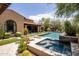 Luxury backyard with a large pool, spa, and lush landscaping at 18826 N 101St Pl # 10, Scottsdale, AZ 85255