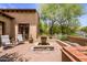 Charming brick patio with fountain and seating area at 18826 N 101St Pl # 10, Scottsdale, AZ 85255