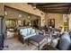 Covered patio features wicker furniture and opens to the living room at 18826 N 101St Pl # 10, Scottsdale, AZ 85255