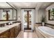 Luxurious bathroom with double vanity and soaking tub at 18826 N 101St Pl # 10, Scottsdale, AZ 85255