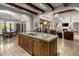 Island kitchen with breakfast bar and hardwood floors at 18826 N 101St Pl # 10, Scottsdale, AZ 85255