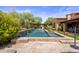 Inviting pool and spa with stone coping and a pergola at 18826 N 101St Pl # 10, Scottsdale, AZ 85255