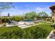 Relaxing backyard oasis with a sparkling pool and artificial turf at 18826 N 101St Pl # 10, Scottsdale, AZ 85255