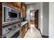 Modern kitchen with built-in appliances and pantry at 18826 N 101St Pl # 10, Scottsdale, AZ 85255