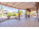 Spacious patio with pergola, landscaping, and outdoor kitchen at 20419 N Shadow Mountain Dr, Surprise, AZ 85374
