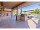 Outdoor patio with built-in grill and seating area at 20419 N Shadow Mountain Dr, Surprise, AZ 85374