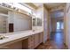 Spacious bathroom with double vanity and view of bedroom at 20419 N Shadow Mountain Dr, Surprise, AZ 85374