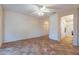 Well-lit bedroom with tile floors and ample closet space at 20419 N Shadow Mountain Dr, Surprise, AZ 85374