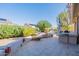 Landscaped backyard with patio and built-in BBQ at 20419 N Shadow Mountain Dr, Surprise, AZ 85374