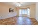 Bright bedroom featuring bay window, tile floors, and ceiling fan at 20419 N Shadow Mountain Dr, Surprise, AZ 85374