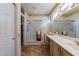 Double vanity bathroom with large shower and tile flooring at 20419 N Shadow Mountain Dr, Surprise, AZ 85374