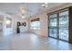 Spacious dining area with tile floors and ceiling fan at 20419 N Shadow Mountain Dr, Surprise, AZ 85374