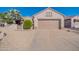 Single-story home with a two-car garage and desert landscaping at 20419 N Shadow Mountain Dr, Surprise, AZ 85374