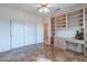 Bedroom featuring double closets and built-in desk at 20419 N Shadow Mountain Dr, Surprise, AZ 85374
