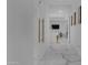 Bright hallway with marble floors and modern gold accents leading to other rooms at 7167 E Rancho Vista Dr # 3003, Scottsdale, AZ 85251