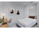 Modern bedroom with built-in workspace and striped bedding at 7167 E Rancho Vista Dr # 3003, Scottsdale, AZ 85251