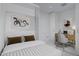 Modern bedroom with built-in workspace and striped bedding at 7167 E Rancho Vista Dr # 3003, Scottsdale, AZ 85251
