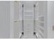 Spacious walk-in closet, built-in shelving, and hanging rods at 7167 E Rancho Vista Dr # 3003, Scottsdale, AZ 85251