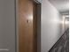 Clean and well-lit hallway with carpeted floor and wood doors at 7167 E Rancho Vista Dr # 3003, Scottsdale, AZ 85251