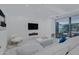 Spacious living area featuring marble floors, white sofas, and access to balcony at 7167 E Rancho Vista Dr # 3003, Scottsdale, AZ 85251