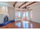 Bright bedroom with hardwood floors, a fireplace, and access to a private balcony at 13978 E Coyote E Rd, Scottsdale, AZ 85259