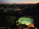 Night view of a refreshing pool overlooking a city panorama at 13978 E Coyote E Rd, Scottsdale, AZ 85259