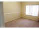 Bedroom with carpeted floors and a large window at 5342 W West Wind Dr, Glendale, AZ 85310