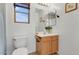 Clean bathroom with wood vanity, toilet, and shower at 3260 E Mead Dr, Gilbert, AZ 85298