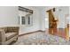 Cozy living room with hardwood floors and a stone accent wall at 3260 E Mead Dr, Gilbert, AZ 85298
