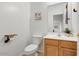 Small bathroom with wood vanity and updated fixtures at 3260 E Mead Dr, Gilbert, AZ 85298