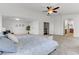 Spacious main bedroom with carpeted floors and ceiling fan at 3260 E Mead Dr, Gilbert, AZ 85298