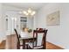 Bright dining room features hardwood floors and a modern chandelier at 3260 E Mead Dr, Gilbert, AZ 85298