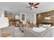 Open living room with hardwood floors, stone accent wall, and comfortable seating at 3260 E Mead Dr, Gilbert, AZ 85298