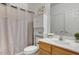 Clean bathroom with wood cabinets and a shower/tub combo at 3260 E Mead Dr, Gilbert, AZ 85298