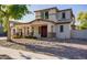 Two-story house with stone accents and landscaping at 3260 E Mead Dr, Gilbert, AZ 85298