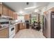 Efficient kitchen featuring wood cabinets, a full suite of appliances, and a breakfast nook at 40667 N Clubhouse St, San Tan Valley, AZ 85140