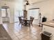 Bright dining room with a table and chairs, near sliding doors at 10826 W Piute Ave, Sun City, AZ 85373