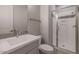 Modern bathroom with a walk-in shower and gray vanity at 23148 E Carriage Way, Queen Creek, AZ 85142