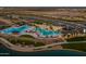 Aerial view of community amenities including pool, lake, and walking paths at 23148 E Carriage Way, Queen Creek, AZ 85142