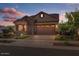 Single story home with a three car garage at 23148 E Carriage Way, Queen Creek, AZ 85142
