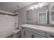 Modern bathroom with a tub, toilet, and vanity at 23148 E Carriage Way, Queen Creek, AZ 85142