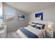 Well-lit bedroom with a queen bed and window view at 23148 E Carriage Way, Queen Creek, AZ 85142