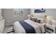 Bright bedroom with a queen-size bed and nightstands at 23148 E Carriage Way, Queen Creek, AZ 85142